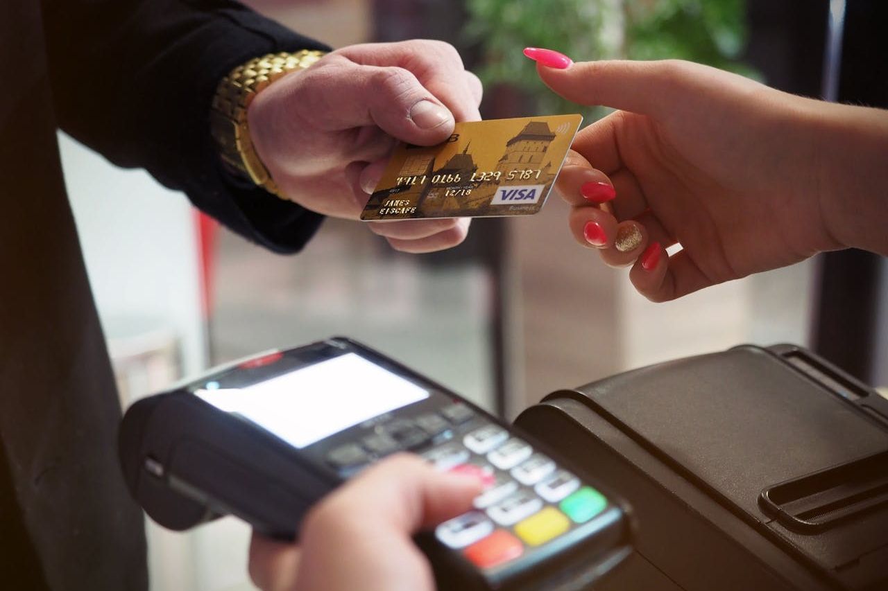 Man paying using his credit card