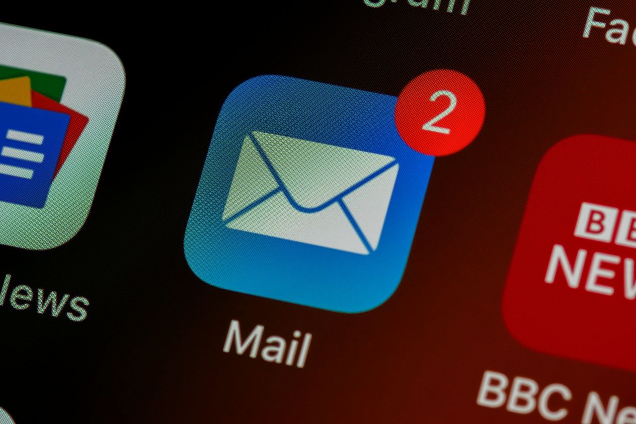 Email logo on a phone screen showing new message alerts
